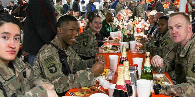 Soldiers at Bagram Airfield in Afghanistan enjoy Thanksgiving dinner in 2018. While this year's Thanksgiving meal may look different, Defense Logistics Agency troop support provided country food. from Thanksgiving to field kitchens, dining rooms and galleys at locations in the United States and around the world.