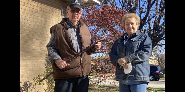 <br> Dan Donovan, joined by his wife, Barbara, holds the antique shillelagh he used to chase burglars from the couple's Niles home even hitting one of the men in the back of the head, Tuesday, Nov. 17, 2020 in Niles, Ill. Donovan, an 81-year-old former Marine from suburban Chicago used his grandfather's antique Irish walking stick to chase off three burglars and deliver one a thump in the head for his trouble.(Jennifer Johnson/Chicago Tribune via AP)