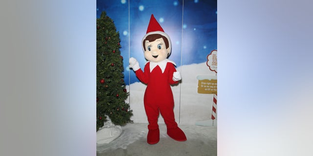 A model dressed as The Elf on the Shelf at a Las Vegas convention in 2016.
