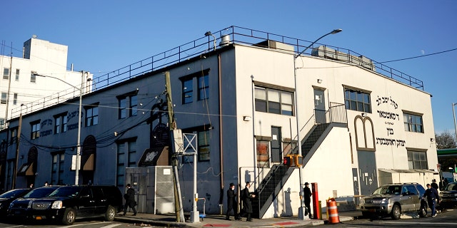 The men will walk past Yetev Lev Church in Brooklyn, New York on Monday, November 23, 2020. A Brooklyn synagogue should be investigated based on reports that it held a secret wedding with thousands of exposed guests earlier this month, New York Governor Andrew Cuomo said Sunday. (AP photo / Frank Franklin II)