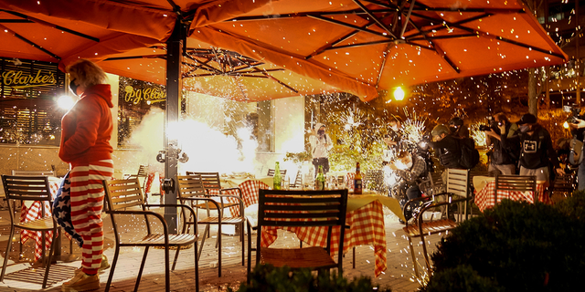Fireworks were set off at a restaurant where a small crowd of Trump supporters were dining.