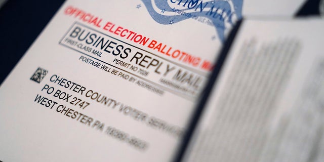 Mail-in ballots for the 2020 General Election in the United States are seen after being sorted at the Chester County Voter Services office in West Chester, Pa.