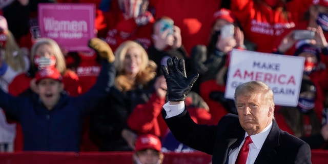 President Trump acknowledges the crowd after speaking at a campaign rally Friday, Oct. 30, 2020, at the Austin Straubel Airport in Green Bay, Wis. (AP Photo/Morry Gash)