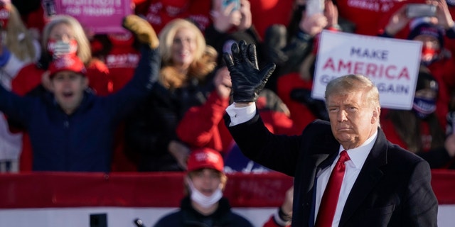 Trump's path to victory includes winning Nevada or Arizona, holding Georgia, North Carolina 2 President Trump acknowledges the crowd after speaking at a campaign rally Friday, Oct. 30, 2020, at the Austin Straubel Airport in Green Bay, Wis. (AP Photo/Morry Gash)