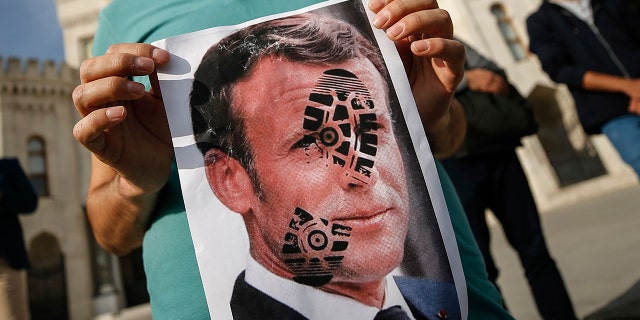 Nurmagomedov shared a picture of the president with a boot mark across his face on social media. (AP Photo/Emrah Gurel)