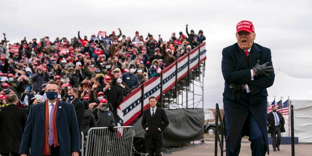 President Donald Trump arrives Oakland County International Airport, Sunday, Nov. 1, 2020, in Waterford Township, Mich. (AP Photo/Evan Vucci)