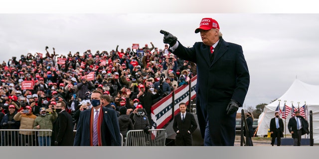 President Trump arrives for a campaign rally at Michigan Sports Stars Park, Sunday, Nov. 1, 2020, in Washington, Mich. (AP Photo/Evan Vucci)