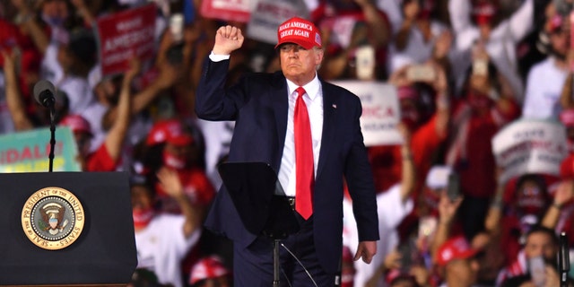 President Donald Trump leaves his campaign rally at Opa-Locka Executive Airport, early Monday, Nov. 2, 2020, in Opa-Locka, Fla.