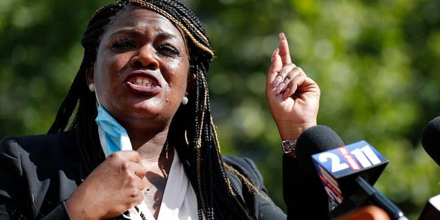 Cori Bush gestures during a news conference on Aug. 5, 2020, in St. Louis.