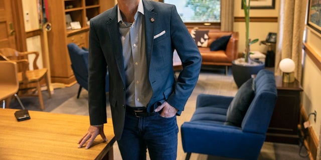 Mayor Ted Wheeler poses in a City Hall office in Portland, Ore. Wheeler won a second term after defeating challenger Sarah Iannarone on Tuesday. (AP Photo/Paula Bronstein, File)