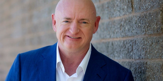 Mark Kelly poses for a photo outside of the Udall Park Main Recreation Center, Tuesday, Sept. 29, 2020 - file photo. (Mamta Popat/Arizona Daily Star via AP)