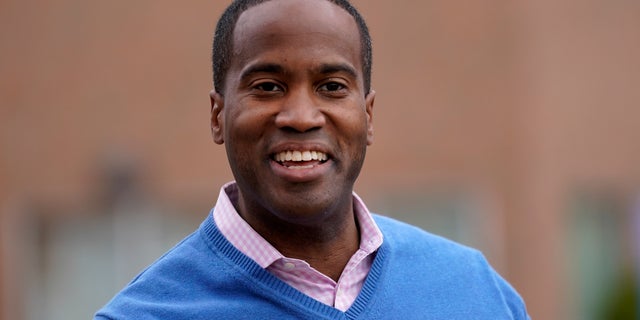 Republican House candidate John James, a 2018 and 2020 GOP Senate nominee, drops off his ballot in Farmington Hills, Michigan, on Oct. 26, 2020.
