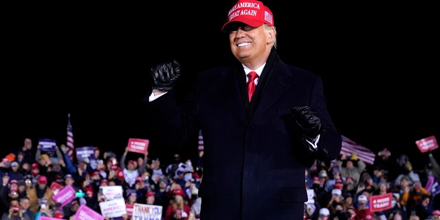 President Donald Trump dances after a campaign rally at Gerald R. Ford International Airport, early Tuesday, Nov. 3, 2020, in Grand Rapids, Mich. (AP Photo/Evan Vucci)