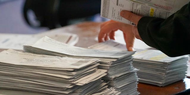 Workers count Milwaukee County ballots on polling day at the central count Tuesday, November 3, 2020 in Milwaukee.  (AP Photo / Morry Gash)