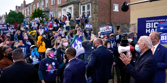 Democratic presidential candidate former Vice President Joe Biden speaks to voters during a stop in Philadelphia, Pa., Tuesday, Nov. 3, 2020. (AP Photo/Carolyn Kaster)