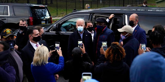 Democratic presidential candidate former Vice President Joe Biden visits with supporters across the street from the Joseph R. Biden Jr. Aquatic Center in Wilmington, Del., Tuesday, Nov. 3, 2020. (AP Photo/Carolyn Kaster)