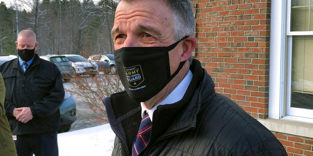 Vermont Republican Gov. Phil Scott speaks to reporters after voting on Tuesday, Nov. 3, 2020, in his hometown of Berlin, Vt. (AP Photo/Wilson Ring)