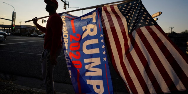 Election betting odds have flipped to favor Trump, expert says 2 Trump supporters gather near the Salt Lake County Government Center Tuesday, Nov. 3, 2020, in Salt Lake City. (AP Photo/Rick Bowmer)