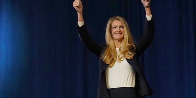 Senate Republican candidate Kelly Loeffler greets supporters as she steps onto the stage at an election night party in Atlanta, Tuesday, November 3, 2020. Loeffler will compete with the candidate. Democrat Raphael Warnock for the US Senate seat. (AP Photo / Tami Chappell)