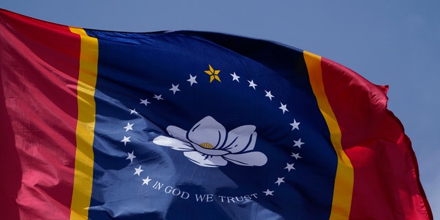 The magnolia centered banner chosen by the Mississippi State Flag Commission displayed outside the Old State Capitol Museum in downtown Jackson, Miss on Sept. 2, 2020. (AP Photo/Rogelio V. Solis, File)