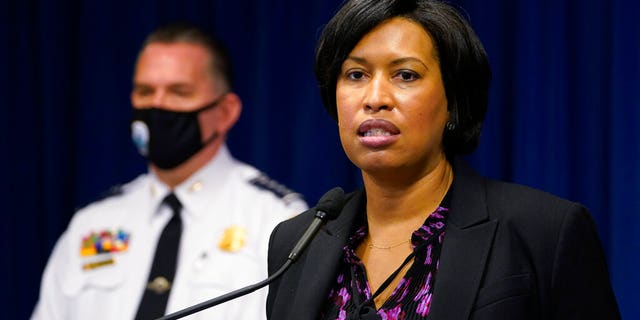 District of Columbia Mayor Muriel Bowser, right, standing next to Metropolitan Police Department chief Peter Newsham, left, speaks during a news conference in Washington, Wednesday, Nov. 4, 2020.