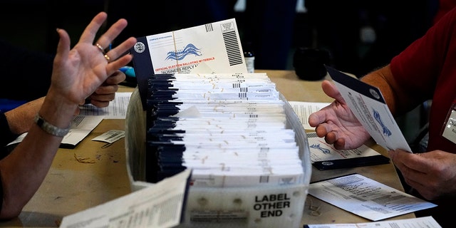 Chester County, Pennsylvania, election workers process mail-in and absentee ballots for the 2020 presidential election at West Chester University, Nov. 4, 2020, in West Chester, Pennsylvania. (Associated Press)