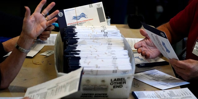 Chester County, Pennsylvania, election workers process mail-in and absentee ballots for the 2020 presidential election at West Chester University, Nov. 4, 2020, in West Chester, Pennsylvania. (Associated Press)