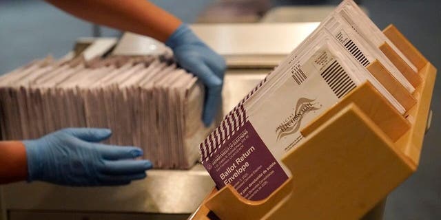 In this file photo from Nov. 1, 2020, envelopes containing ballots are displayed at a polling center in San Francisco.  (AP Photo / Jeff Chiu, file)