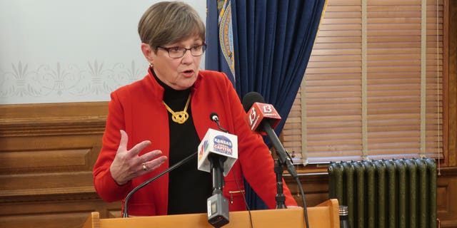 Kansas Gov. Laura Kelly speaks to reporters during a Statehouse news conference in Topeka, Kan. Democratic Party leaders want to oust Democratic state Rep.-elect Aaron Coleman, D-Kansas City, over a tweet he made criticizing the governor that they view as threatening. Coleman admitted to circulating revenge porn and was charged at the age of 14 with threatening to shoot a high school student. (AP Photo/John Hanna)
