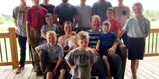 The Schwandt family poses for a photo at their farm in Lakeview, Michigan, in 2018. (AP Photo/Mike Householder, File)