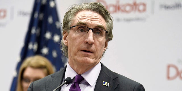 In this April 10, 2020, file photo, North Dakota Gov. Doug Burgum speaks at the state Capitol in Bismarck, N.D. He has the chance to either sign or veto a bill banning critical race theory in North Dakota's public schools after it passed the state Senate Friday. (Mike McCleary/The Bismarck Tribune via AP, File)