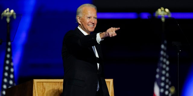 President-elect Joe Biden points to the crowd as he stands on stage after speaking on Saturday, November 7, 2020 in Wilmington, Del.  (AP Photo / Andrew Harnik)