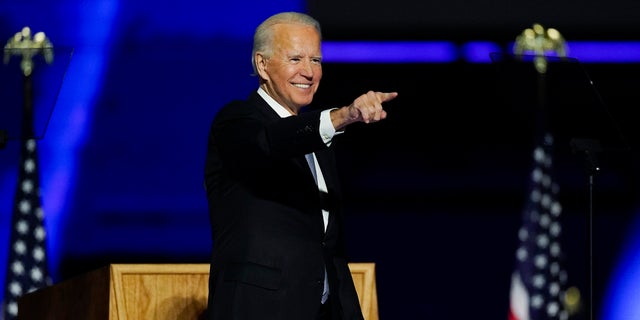 President-elect Joe Biden points to the crowd as he stands on stage after speaking Saturday, Nov. 7, 2020, in Wilmington, Del. (AP Photo/Andrew Harnik)