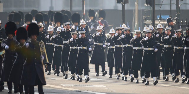 Members of the Royal Navy march, ahead of the Remembrance Sunday service at the Cenotaph, in Whitehall, London, Sunday Nov. 8, 2020. (Aaron Chown, Pool Photo via AP)