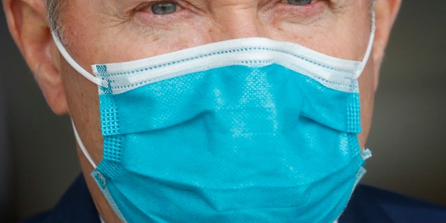 Utah Gov. Gary Herbert wears a mask during a news conference, in Salt Lake City on April 15, 2020. (AP Photo/Rick Bowmer, File)