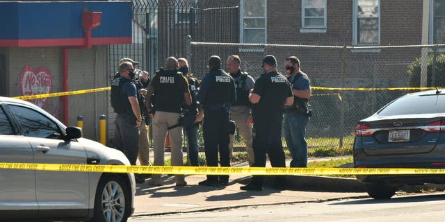 Baltimore police investigate the scene of a shooting in the city's Rosemont neighborhood Monday morning, Nov. 9, 2020. (Amy Davis/The Baltimore Sun via AP)