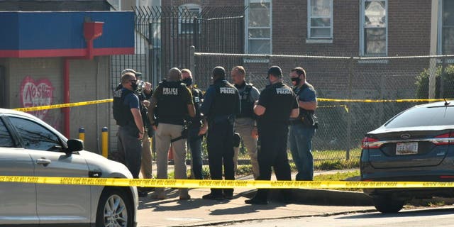 Baltimore police investigate the scene of a shooting in the city's Rosemont neighborhood Monday morning, Nov. 9, 2020. (Amy Davis/The Baltimore Sun via AP)