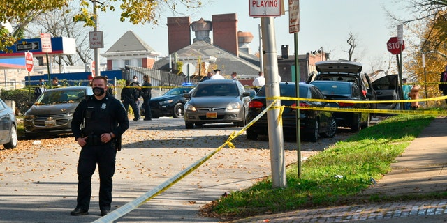 Baltimore Police are investigating the scene of a shooting incident in the city's Rosemont neighborhood on Monday, November 9, 2020 (Amy Davis / The Baltimore Sun via AP)