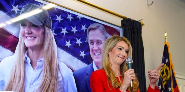 Georgia Republican Senator Kelly Loeffler speaks at a campaign rally Wednesday November 11, 2020 in Marietta, Ga. She and Senator David Perdue, also a Republican of Georgia, called on the GOP Secretary of State to step down. week.  (AP Photo / John Bazemore)