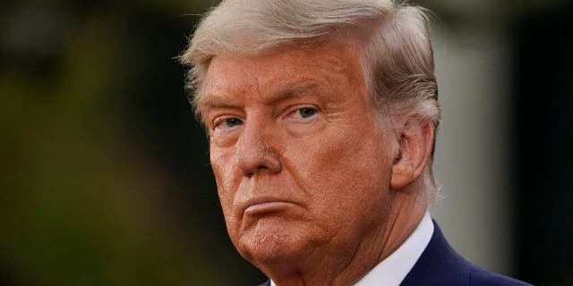 Then-President Donald Trump listens during an event on Operation Warp Speed in the Rose Garden of the White House in Washington on Nov. 13, 2020.