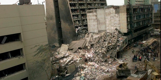 The United States Embassy, left, and other damaged buildings in downtown Nairobi, Kenya, on Aug. 8, 1998, the day after terrorist bombs exploded in Kenya and Dar es Salaam, Tanzania. The United States and Israel worked together to track and kill Abu Mohammed al-Masri, a senior Al Qaeda operative in Iran earlier this year. Al-Masri was gunned down in a Tehran alley on August 7, 2020 the anniversary of the 1998 bombings of the U.S. Embassies in Nairobi, Kenya, and Dar es Salaam, Tanzania. (AP Photo/Dave Caulkin, File)