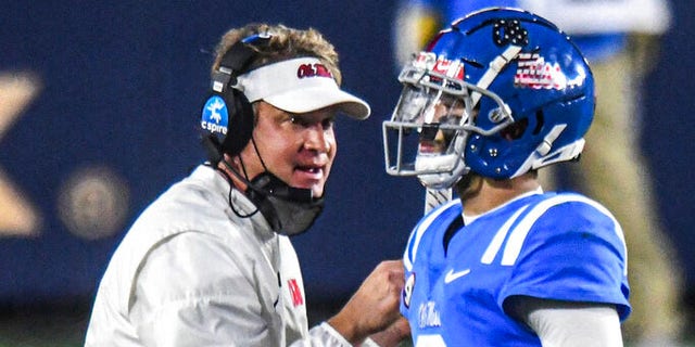 Mississippi coach Lane Kiffin talks with quarterback Matt Corral (2) durng the second half of the team's NCAA college football game against South Carolina in Oxford, Miss., Saturday, Nov. 14, 2020.