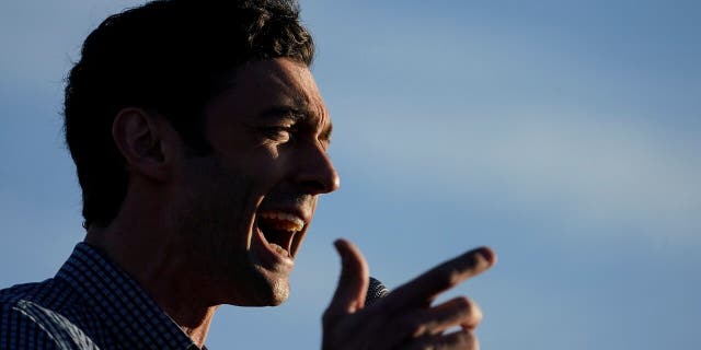 Georgia Democratic candidate for U.S. Senate Jon Ossoff speaks during a rally on Sunday, Nov. 15, 2020, in Marietta, Ga. Ossoff and Republican candidate for Senate Sen. David Perdue are in a runoff election for the Senate seat. (AP Photo/Brynn Anderson)