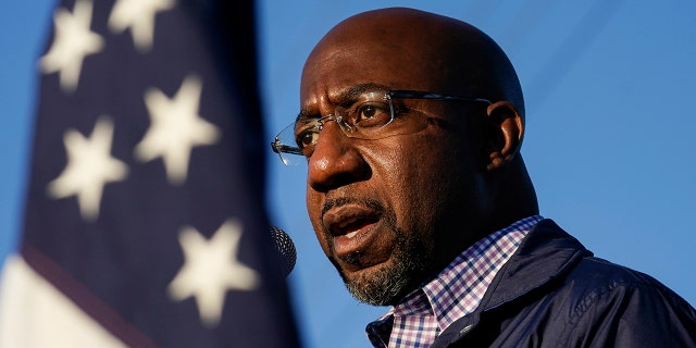 Raphael Warnock, a Democratic candidate for the U.S. Senate, speaks during a campaign rally on Sunday, Nov. 15, 2020, in Marietta, Ga. Warnock and U.S. Sen. Kelly Loeffler are in a runoff election for the Senate seat. (AP Photo/Brynn Anderson)