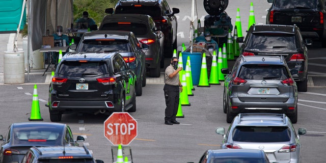 US COVID testing sites see miles-long lines, delays ahead of holidays 1 In this Nov. 18 photo, vehicles line up to be tested at the COVID-19 drive-thru testing center at Miami Beach Convention Center in Miami Beach, Fla. With coronavirus cases surging and families hoping to gather safely for Thanksgiving, long lines to get tested have reappeared across the U.S. (David Santiago/Miami Herald via AP, File)