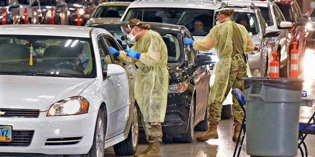 Motorists line up for coronavirus tests by car at an unspecified location.  (Associated press)