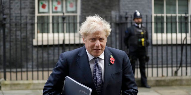 FILE - In this Tuesday, Nov. 10, 2020 file photo, British Prime Minister Boris Johnson leaves 10 Downing Street in London, to attend a weekly cabinet meeting at the Foreign, Commonwealth &amp; Development Office, in London.  (AP Photo/Matt Dunham, File)