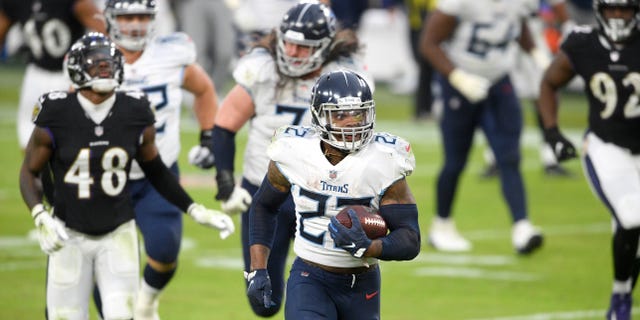 Tennessee Titans running back Derrick Henry (22) runs for a game-winning touchdown against the Baltimore Ravens during overtime of an NFL football game, Sunday, Nov. 22, 2020, in Baltimore. The Titans won 30-24 in overtime. (AP Photo/Nick Wass)