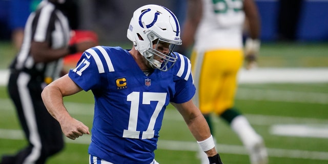 Indianapolis Colts quarterback Philip Rivers (17) reacts after throwing a touchdown pass during the first half of an NFL football game against the Green Bay Packers, Sunday, Nov. 22, 2020, in Indianapolis. (AP Photo/Michael Conroy)