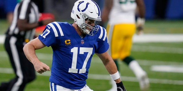 Indianapolis Colts quarterback Philip Rivers (17) reacts after throwing a touchdown pass during the first half of an NFL football game against the Green Bay Packers, Sunday, Nov. 22, 2020, in Indianapolis. (AP Photo/Michael Conroy)
